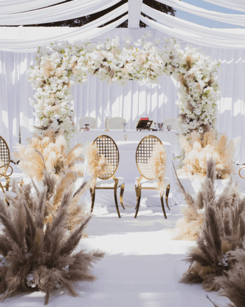 A wedding venue with a floral archway